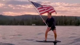 Mark Zuckerberg skate an electric hydrofoil surfboard just as the sun sets over a body of water.jpg